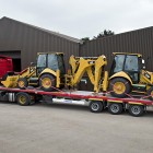 Flatbed trailer loaded with machinery